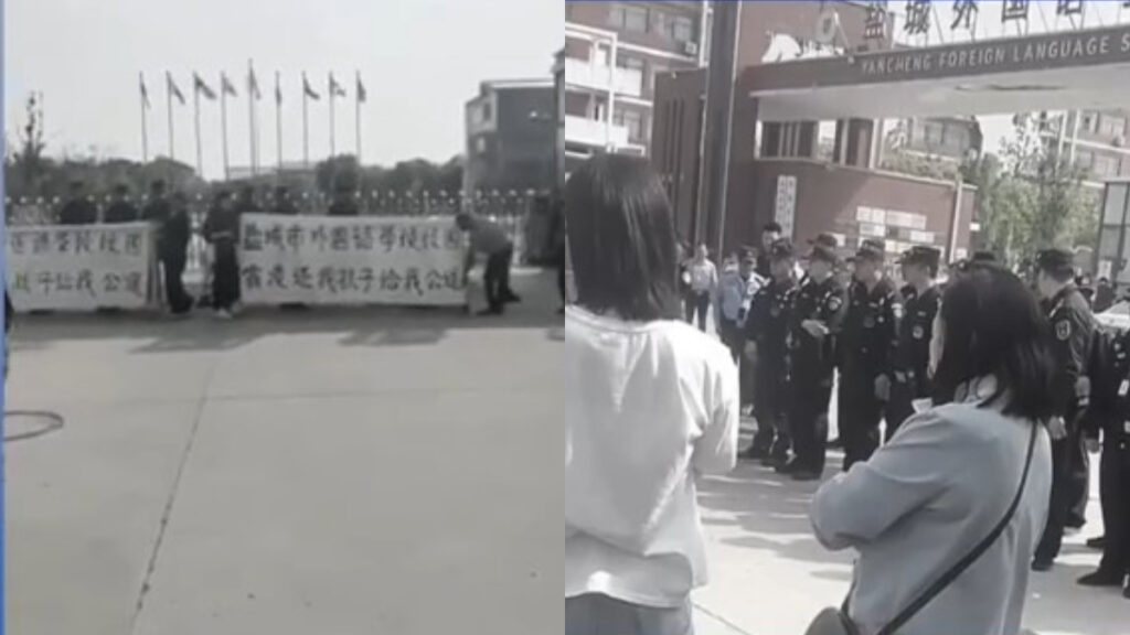 学校前に掲げられる涙の横断幕　届かぬ正義＝中国